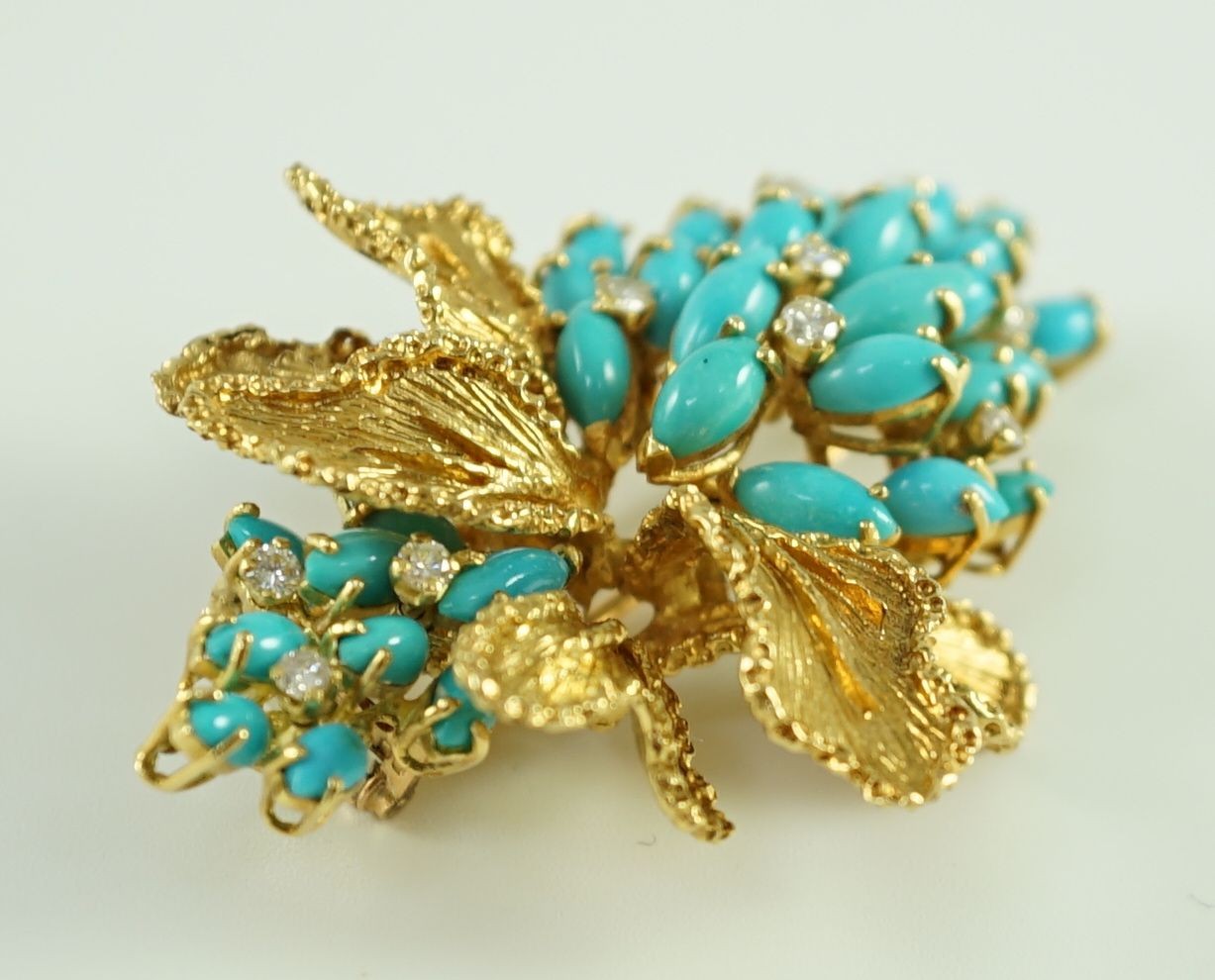 A 1970's textured 18ct gold, turquoise and diamond set cluster clip brooch